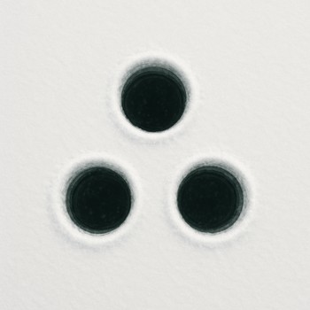 Triangle pattern of three ice holes viewed from above